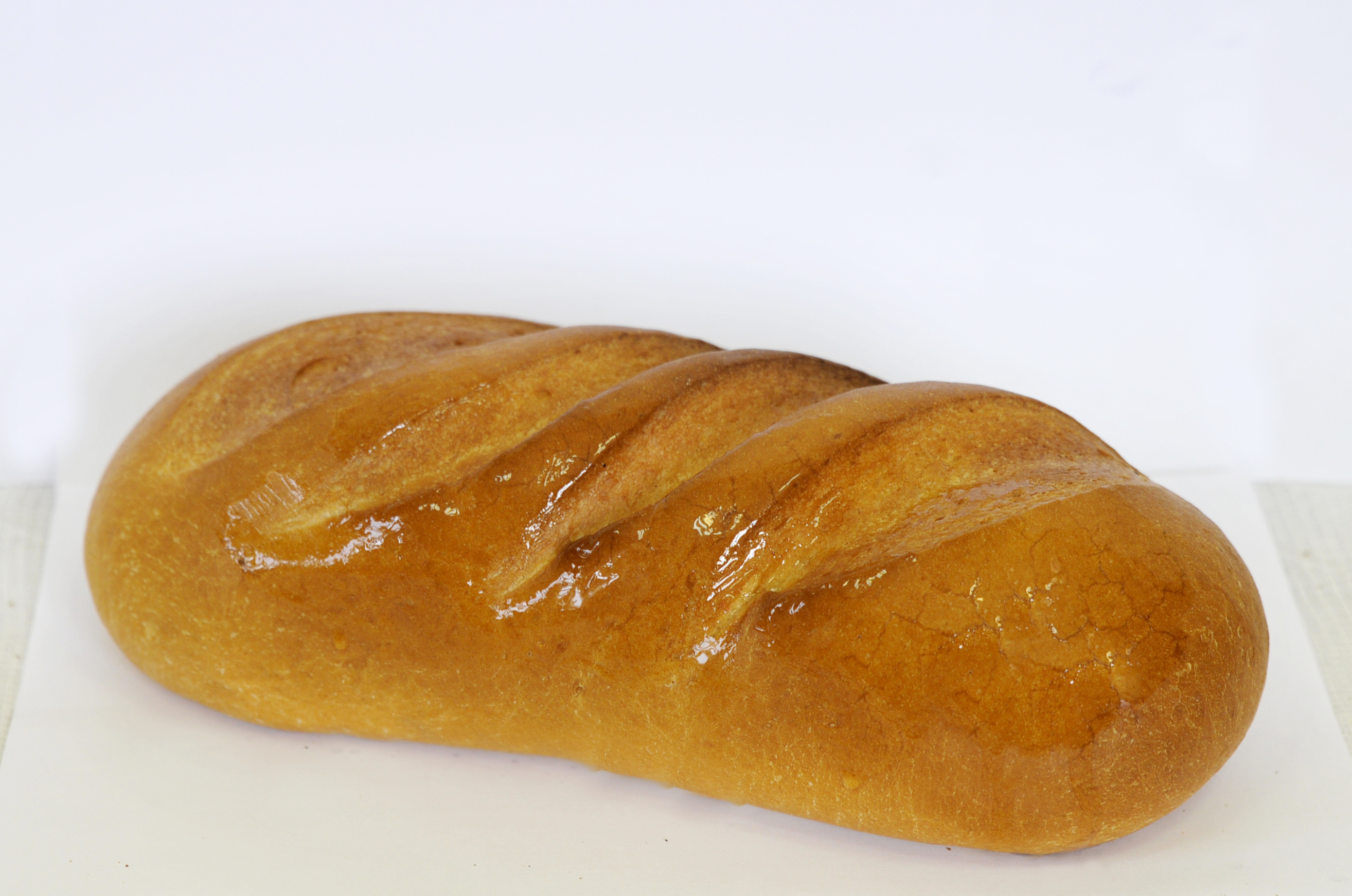 Горчичный хлеб рецепт. Горчичный хлеб. Батон овальный. Батон горчичный нарезной. Хлеб горчичный формовой.
